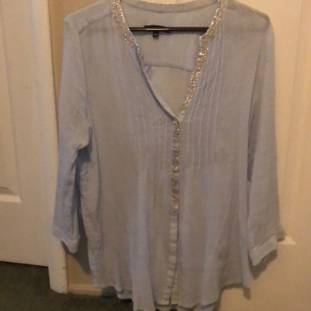Woman’s blouse great condition, size large, baby blue and silver.